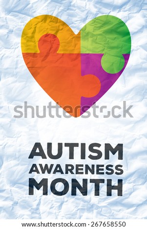 autism awareness month against crumpled white page