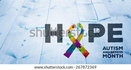 autism awareness month against bleached wooden planks background