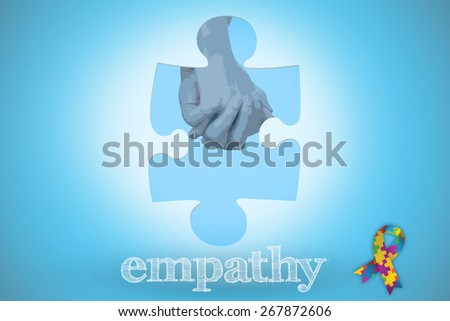 The word empathy and couple in check shirts and denim holding hands against blue background with vignette
