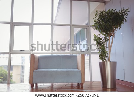 Reception area with couch and large window