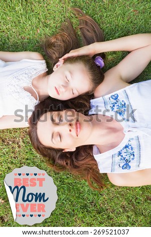 best mom ever against mother and daughter lying on grass