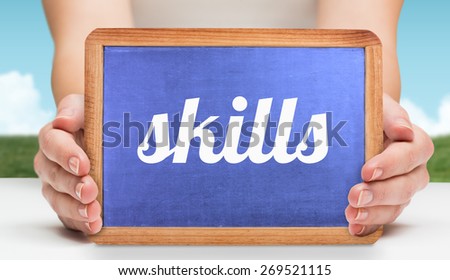 The word skills and hands showing chalkboard against field and sky