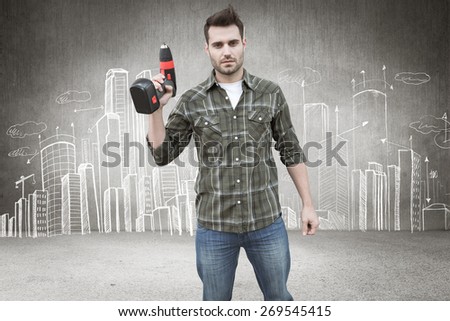 Worker holding drill against hand drawn city plan