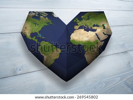 Heart shaped earth against bleached wooden planks background