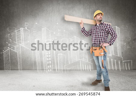 Handyman holding wood planks against hand drawn city plan