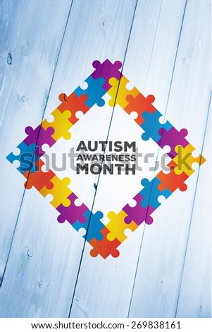 Autism awareness month against bleached wooden planks background