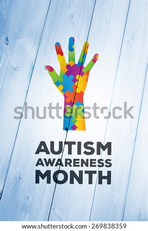 Autism awareness month against bleached wooden planks background