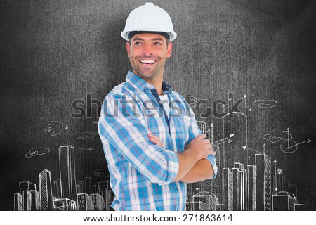 Smiling male worker standing arms crossed against hand drawn city plan