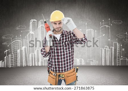 Confident handyman holding drill machine against hand drawn city plan
