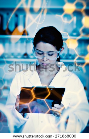 Science and medical graphic against portrait of a scientist taking notes