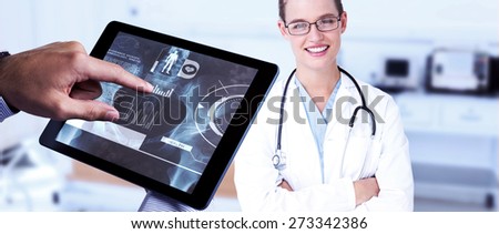Man using tablet pc against empty bed in the hospital room
