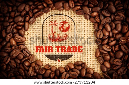 Fair Trade graphic against coffee beans with speech bubble indent for copy space