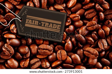 Fair Trade graphic against close up of coffee seeds
