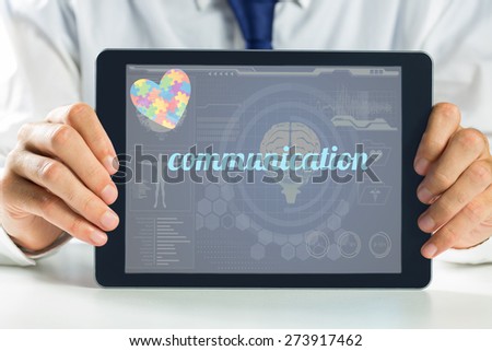 The word communication and autism awareness heart against medical biology interface in blue