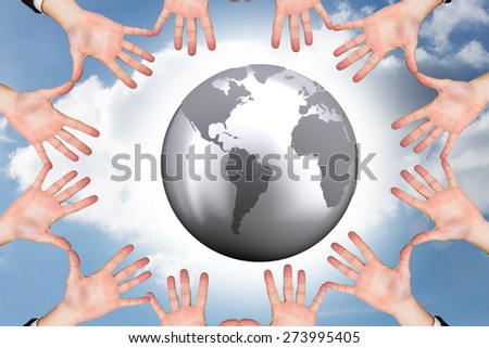 Circle of hands against cloudy sky