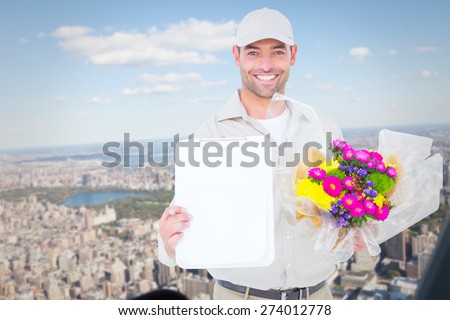 Flower delivery man showing clipboard against new york