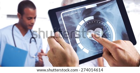 Man using tablet pc against doctors using a tablet