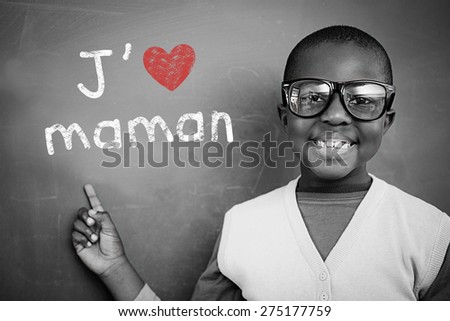 Schoolchild with blackboard against french mothers day message