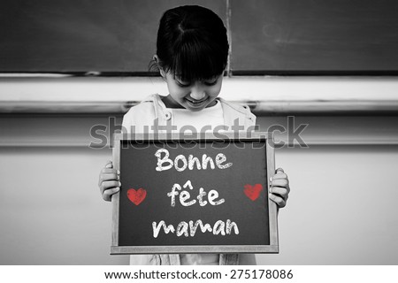 French mothers day message against schoolchild with blackboard