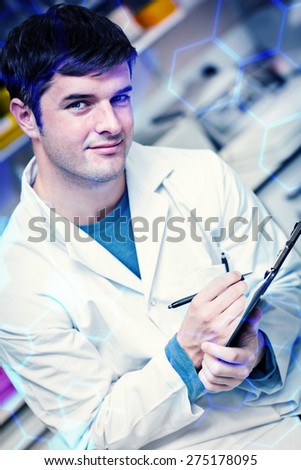 Science formula against handsome scientist holding a clipboard and smiling at the camera