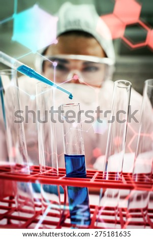 Science and medical graphic against portrait of a protected science student dropping blue liquid in a test tube