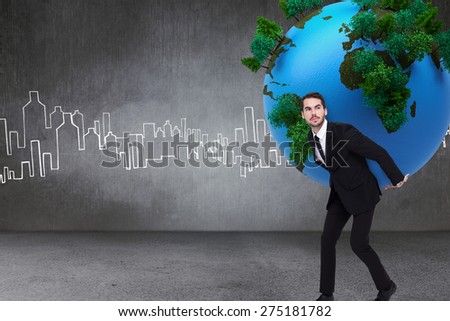 Businessman carrying the world against hand drawn city plan