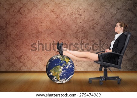 Businesswoman sitting on swivel chair with feet up against grimy room