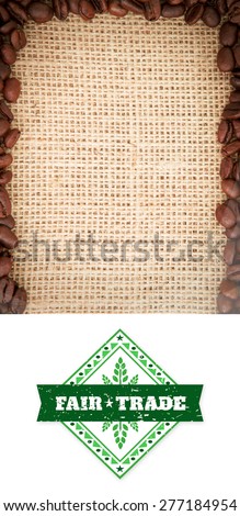 Fair Trade graphic against frame of coffee beans
