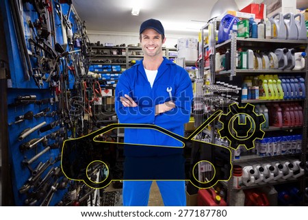 Confident mechanic holding wheel wrenches against full store room