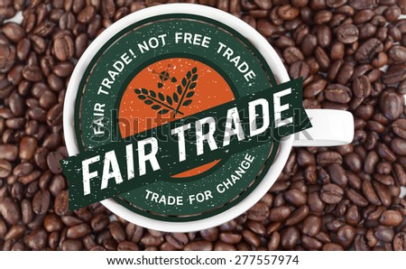 Fair Trade graphic against small white cup full of coffee beans
