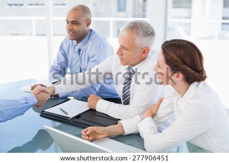 Businessman shaking hand during work interview in the office