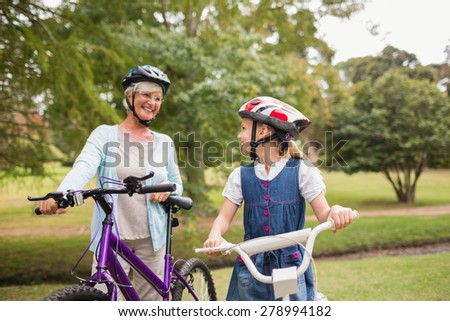 Grandmother and daughter on their bike on a sunny day