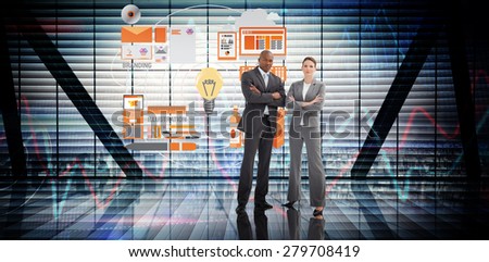 Confident business team against stocks and shares on black background