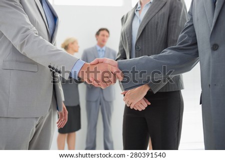 Business people shaking hands in the meeting room
