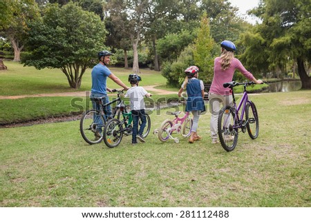 Family on their bike at the park on a sunny day