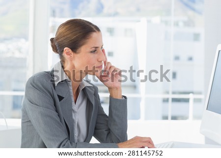 Concentrate businesswoman using computer in office