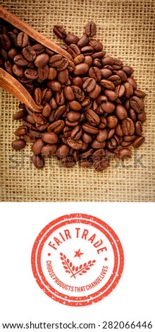 Fair Trade graphic against wooden shovel with coffee beans