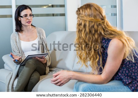 Psychologist talking with her patient in the office
