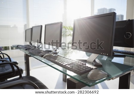 composite image of computer in front of window in office