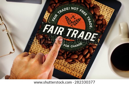 Man using tablet pc against fair trade