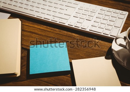 Overhead shot of post its and keyboard on a desk