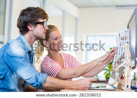 Professional designers working on photos in the office