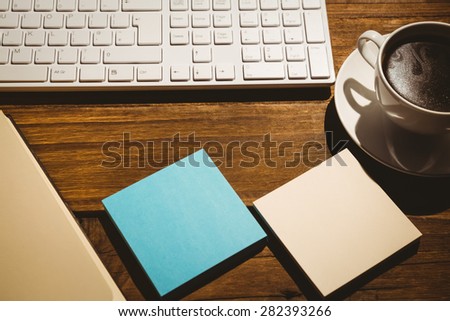 Overhead shot of post its and keyboard on a desk