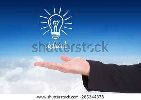 Businessman holding hand out in presentation against blue sky over clouds