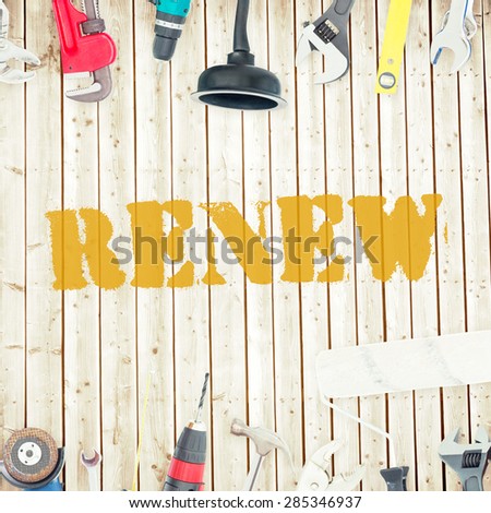 The word renew against tools on wooden background