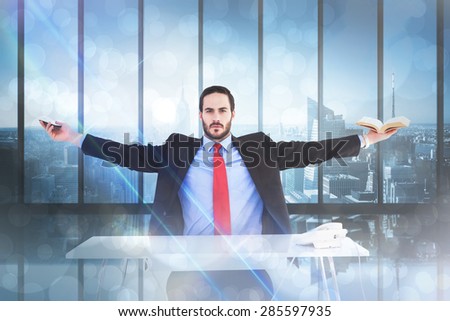 Unsmiling businessman sitting with arms outstretched against room with large window looking on city