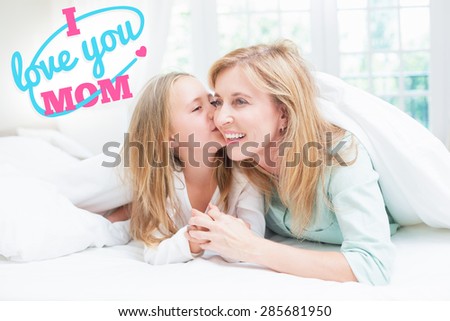 mothers day greeting against daughter kissing her mother on the cheek in the bed