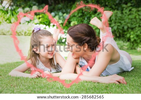 smoke heart against mother and daughter smiling at each other