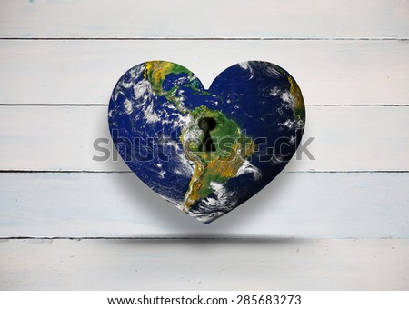 Heart shaped earth against painted blue wooden planks