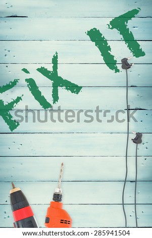 The word fix it against tools on wooden background